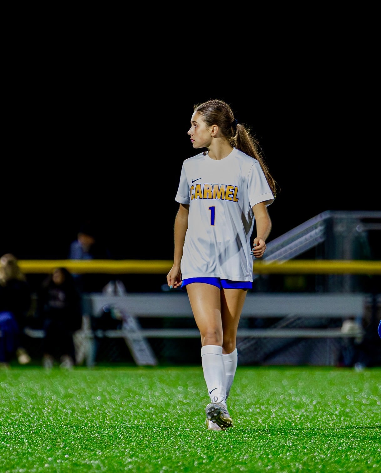 Savannah Hindman walking across a soccer field